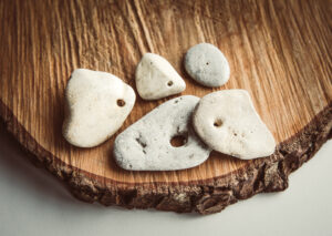 Hag stones on a wooden plate