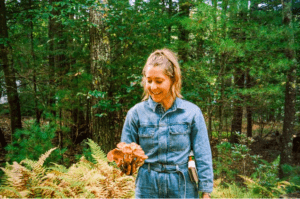 Danielle Ryan Broida from Four Sigmatic Holding a mushroom