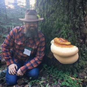 Roo sitting beside a Ganoderma