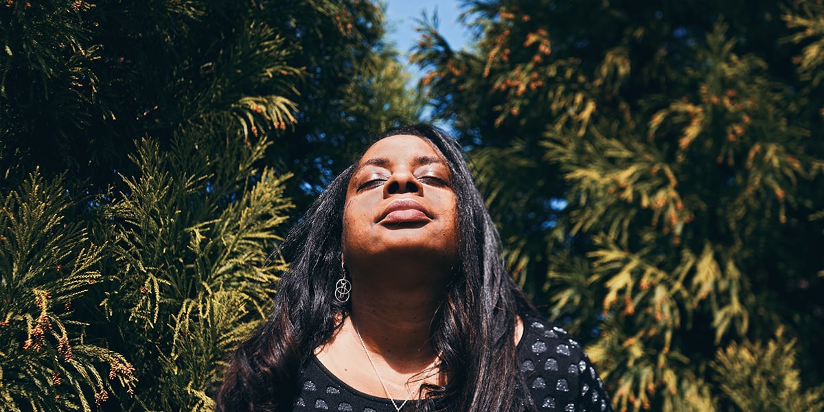 Woman Exposing Face To Sunlight For Vitamin D