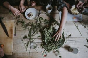 People preparing a meal together to better connect with nature.