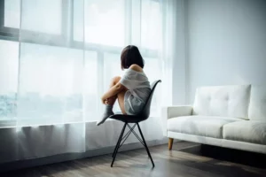 sad woman sitting in chair