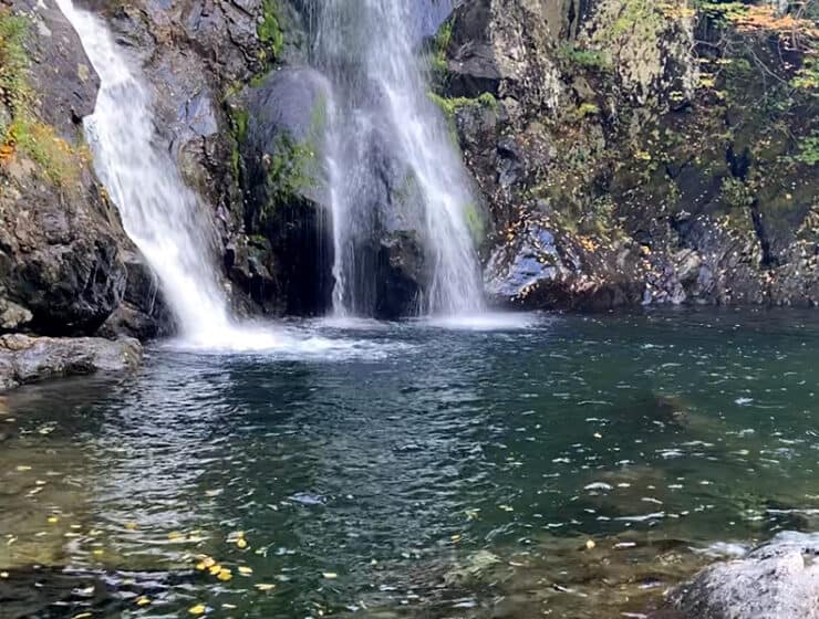 landscape image of the waterfall Oshun Sacred Grove